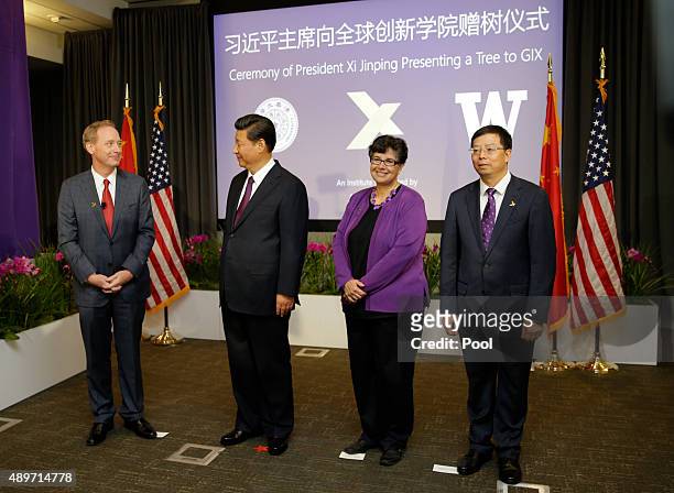 Microsoft President Brad Smith, Chinese President Xi Jinping, University of Washington Interim President Ana Mari Cauce, and Tsinghua University...