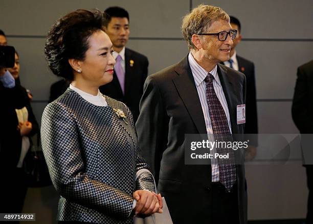 Peng Liyuank, wife of Chinese President Xi Jinping, stands with Microsoft founder Bill Gates during a tour of the main campus of Microsoft Corp....