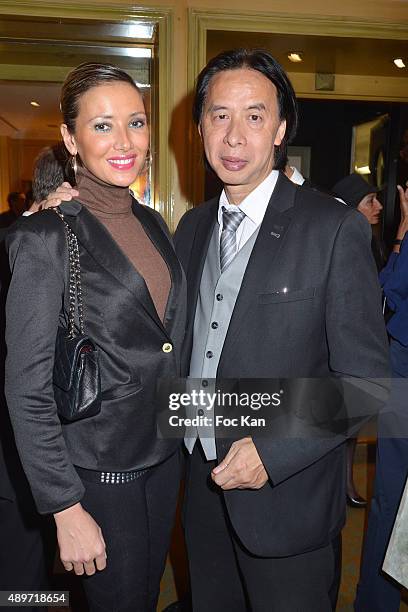 Model Marina Lek and photographer Patrick Maghic attend the Hotel Westminster Shop Window Unveiling on September 23, 2015 in Paris, France.