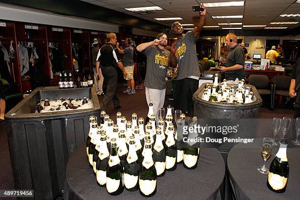 The Pittsburgh Pirates celebrate clinching a playoff spot after their 13-7 victory over the Colorado Rockies at Coors Field on September 23, 2015 in...