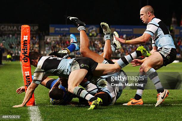 Will Hopoate of the Eels is tackled over the sideline during the round nine NRL match between the Parramatta Eels and the Cronulla-Sutherland Sharks...