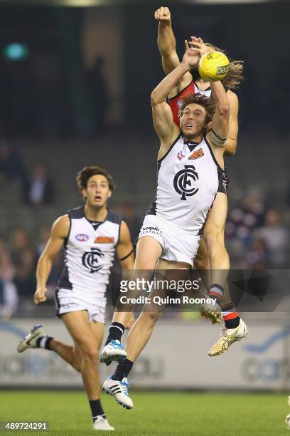 Dale Thomas of the Blues marks infront of Josh Bruce of the Saints during the round eight AFL match between the St Kilda Saints and the Carlton Blues...