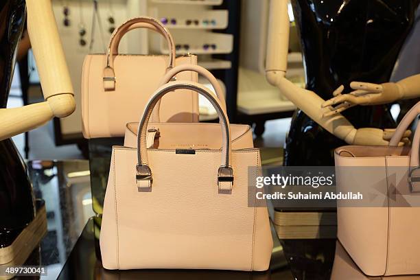 Handbags of Victoria Beckham label are seen at On Pedder at Scotts Square on May 12, 2014 in Singapore. Victoria Beckham is in Singapore for the...