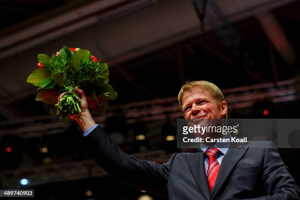 Newly elected chairman of the German Confederation of Trade Unions Reiner Hoffmann cheers after his is elected at the Federal Congress of the...