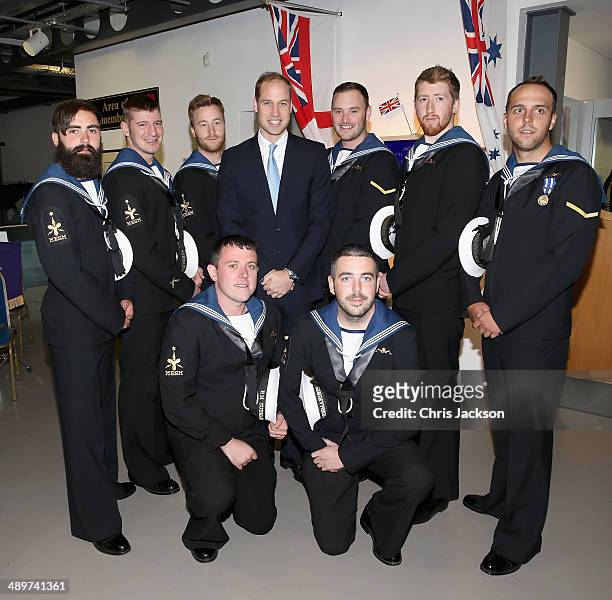 Prince William, Duke of Cambridge poses with Submariners during a reception at the Royal Navy Submarine Museum on May 12, 2014 in Gosport, England.