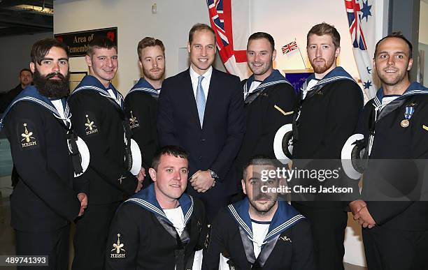 Prince William, Duke of Cambridge poses with Submariners during a reception at the Royal Navy Submarine Museum on May 12, 2014 in Gosport, England.