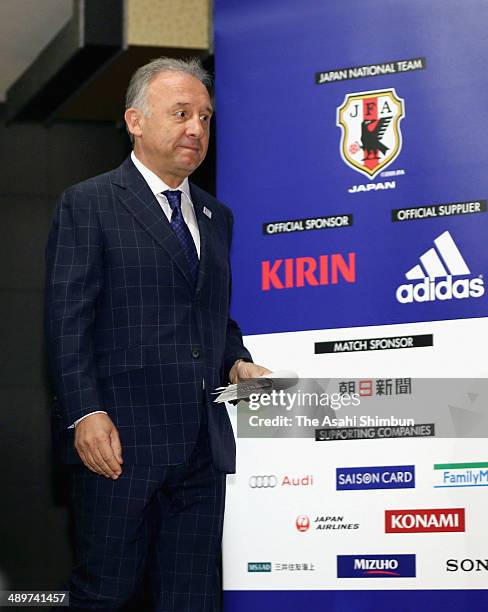 Head coach Alberto Zaccheroni enters a room to announce the Japan squad for the 2014 FIFA World Cup during a news conference at Grand Prince Hotel...