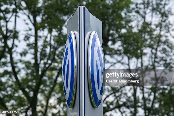 The VW logo stands on a sign outside the Volkswagen AG headquarters in Wolfsburg, Germany, on Wednesday, Sept. 23, 2015. Volkswagen's escalating...