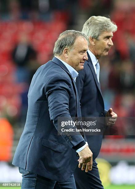 Sunderland head coach Dick Advocaat and Manchester City manager Manuel Pellegrini during the Capital One Cup Third Round match between Sunderland and...