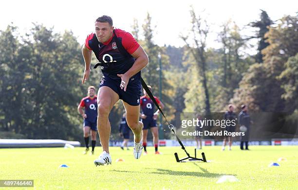 Sam Burgess, the England centre, pulls the weight sledge during the England training session at Pennyhill Park on September 24, 2015 in Bagshot,...