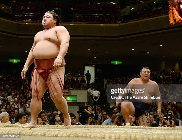 Yoshikaze reacts after his win against Ikiioi during day twelve of the Grand Sumo Autumn Tournament at Ryogoku Kokugikan on September 24, 2015 in...