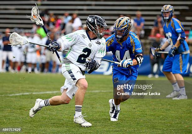 Brendan Mundorf of the Chesapeake Bayhawks and Brett Schmidt of the Charlotte Hounds during their game at American Legion Memorial Stadium on May 10,...