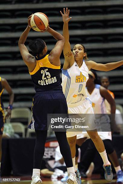 Courtney Clements defends against Marissa Coleman of the Indiana Fever during the game against the Chicago Sky as part of the WNBA Preseason...