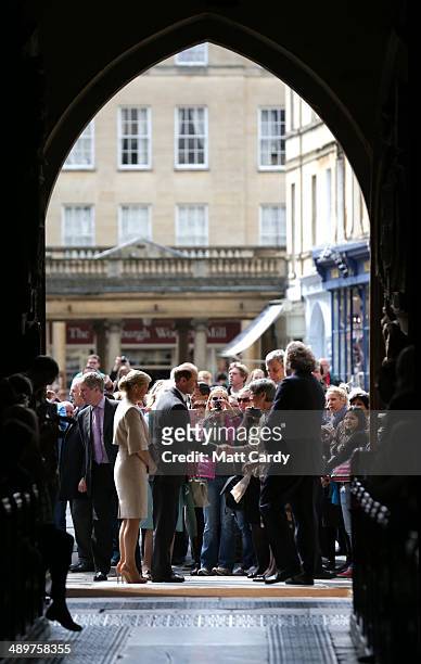 Prince Edward, Earl of Wessex and Sophie, Countess of Wessex shake hands with members of the public as they walk in through the West Door from the...