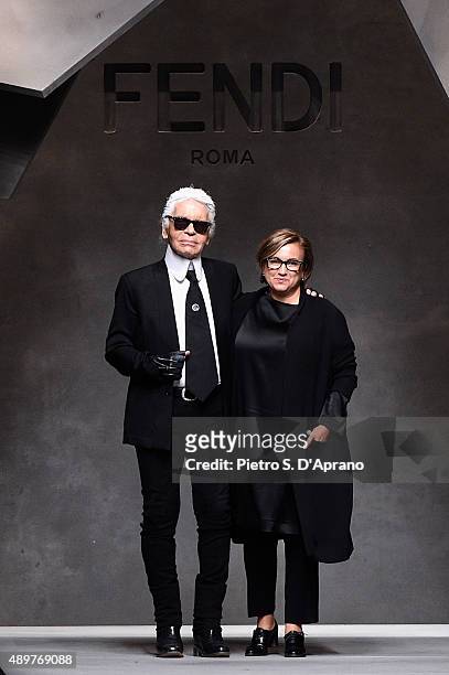 Designers Silvia Venturini Fendi and Karl Lagerfeld acknowledge the applause of the audience after the Fendi fashion show as part of Milan Fashion...