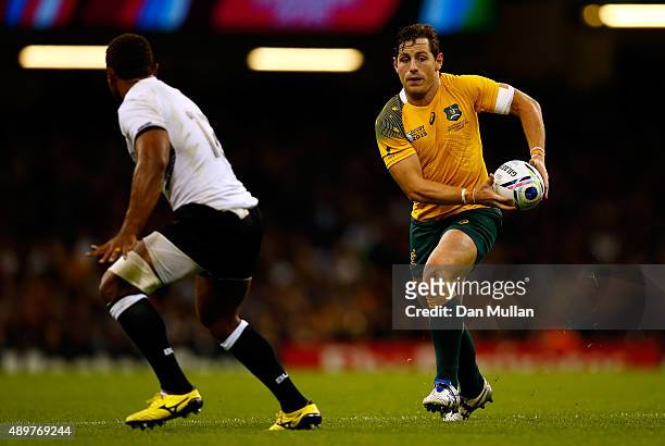 Bernard Foley of Australia takes on Gabrieli Lovobalavu of Fiji during the 2015 Rugby World Cup Pool A match between Australia and Fiji at the...