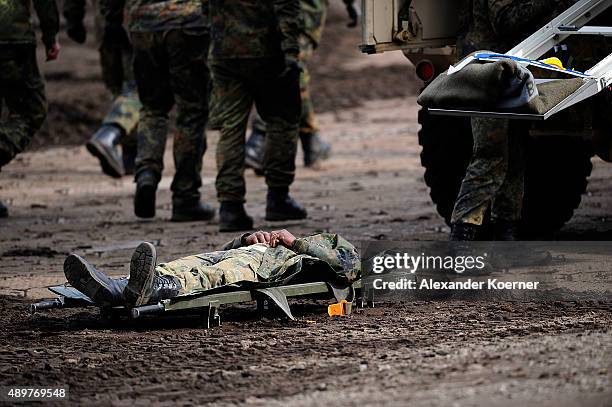Soldier of the German Armed Forces lays on a stretch during an excercise at the Bundeswehr training ground on September 24, 2015 in Munster, Germany....