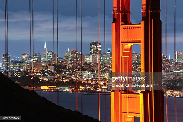 golden gate bridge and cityscape of san francisco, california, usa - bridge architecture up close night stock pictures, royalty-free photos & images