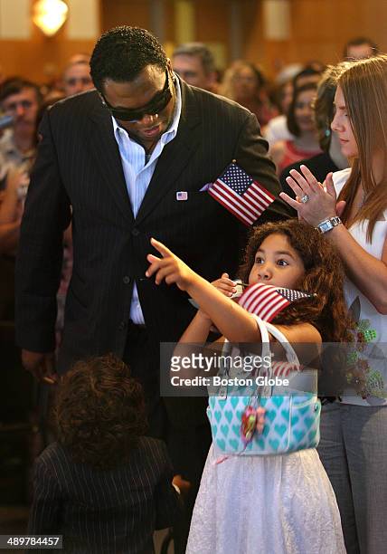After becoming a U.S. Citizen during a ceremony at the John F. Kennedy Library, on Wednesday, June 11 Boston Red Sox star David Ortiz stands with his...