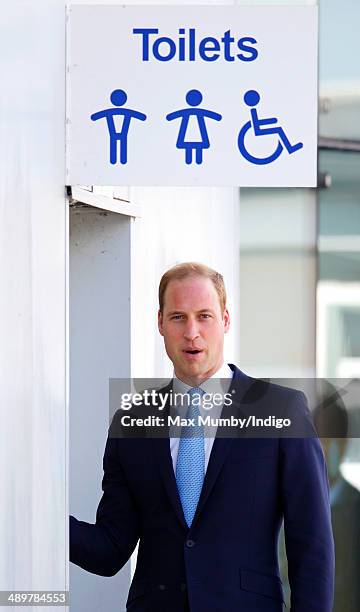 Prince William, Duke of Cambridge goes into a public toilet as he arrives for a visit to the Royal Navy Submarine Museum on May 12, 2014 in Gosport,...
