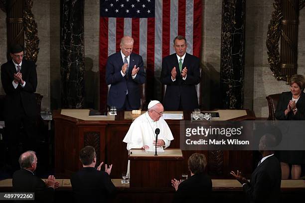 Vice President Joe Biden and Speaker of the House John Boehner applaud Pope Francis after his speech in a joint meeting of the U.S. Congress in the...