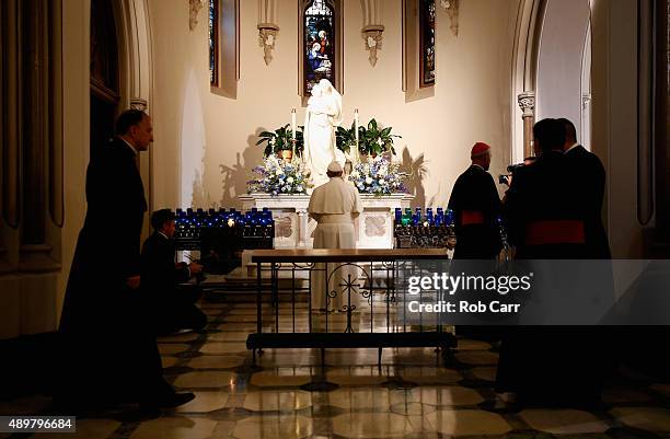 Pope Francis prays during a visit to St. Patrick's Catholic Church on September 24, 2015 in Washington, DC. The Pope is on a six-day trip to the...