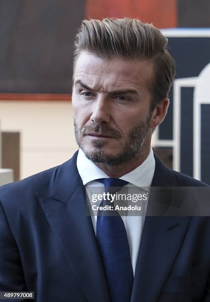 Goodwill Ambassador David Beckham poses amidst a digital installation at the unveiling of a digital installation that brings the voices of young...