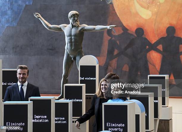 Goodwill Ambassador David Beckham poses amidst a digital installation at the unveiling of a digital installation that brings the voices of young...