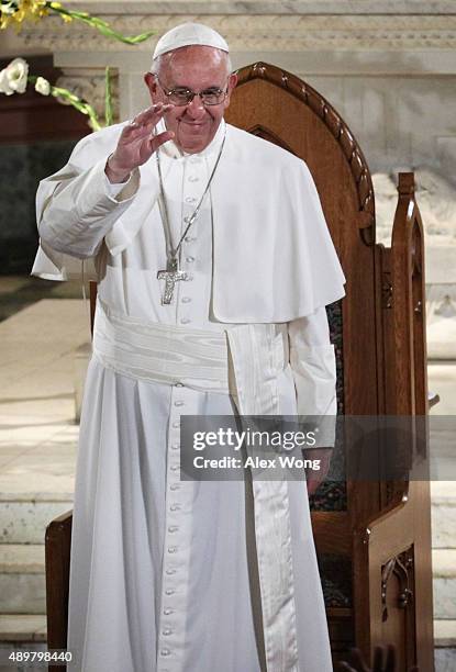 Pope Francis waves to the congregation during his visit at St. Patrick's Catholic Church September 24, 2015 in Washington, DC. The Pope is on his...