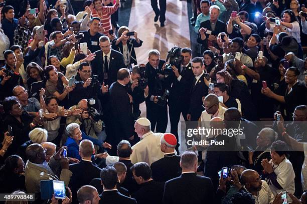 Pope Francis greets people as he arrives to pray and visit St. Patrick's Church on September 24, 2015 in Washington, DC. Pope Francis is on a...