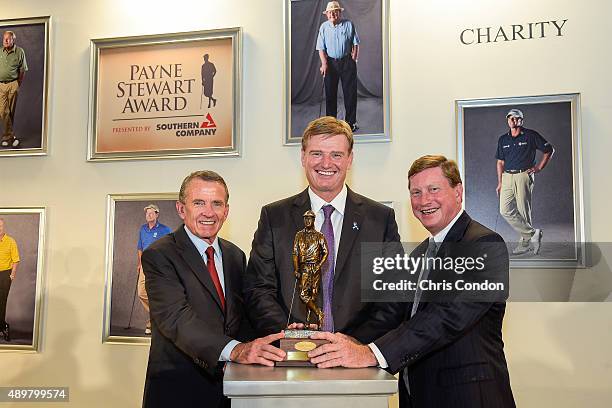 Commissioner Tim Finchem, Payne Stewart Award recipient Ernie Els, and Southern Company CEO Tom Fanning pose at an award ceremony for Els, held...