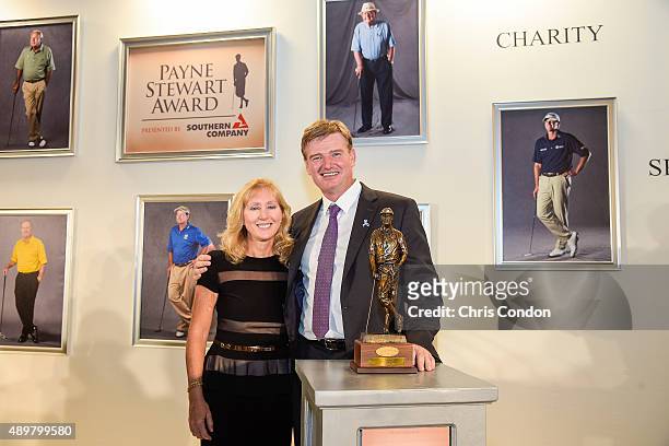 Payne Stewart Award recipient Ernie Els poses with the late Stewart's wife Tracey Stewart an award ceremony held following practice for the TOUR...