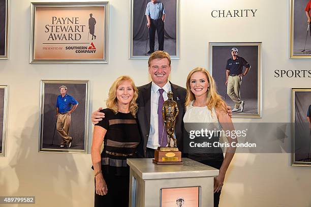 Payne Stewart Award recipient Ernie Els poses with the late Stewart's wife Tracey Stewart and their daughter Chelsea an award ceremony held following...