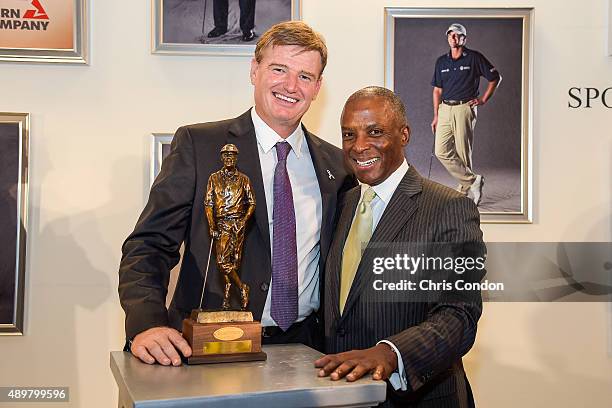 Payne Stewart Award recipient Ernie Els poses with Southern Company President of External Affairs Christopher Womack during an award ceremony held...