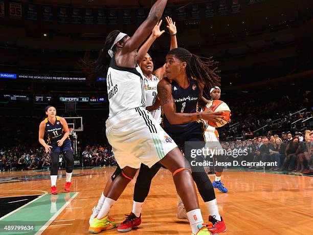 Shavonte Zellous of the Indiana Fever looks to pass the ball against the New York Liberty defense in Game One of the WNBA Eastern Conference Finals...