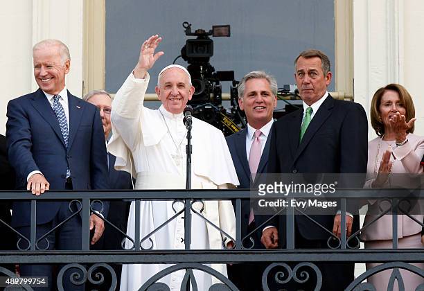 Pope Francis waves to crowd from the balcony of the US Capitol building, after his address to a joint meeting of the U.S. Congress as U.S. Vice...