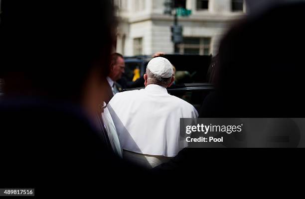 Pope Francis gets into his Fiat as he leaves a visit to Catholic Charities of the Archdiocese of Washington September 24, 2015 in Washington, DC....