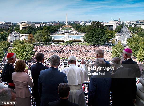 Pope Francis waves to the crowd from the Speakers Balcony at the US Capitol, September 24, 2015 in Washington, DC. Pope Francis will be the first...