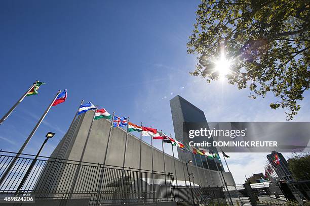 International flags fly in front of the United Nations headquarters on September 24 before the start of the 70th General Assembly meeting. AFP...