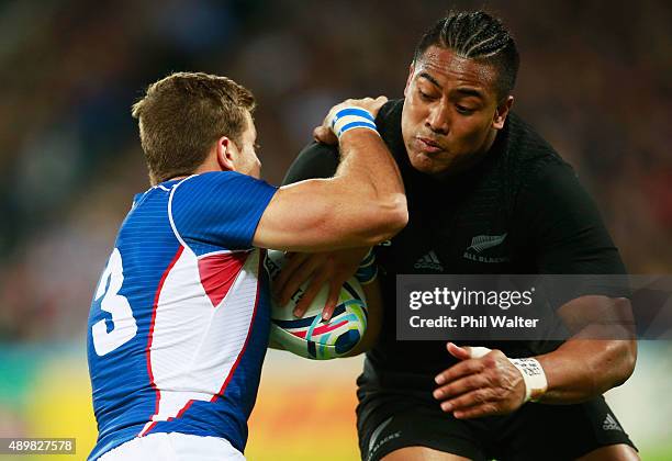 Julian Savea of the New Zealand All Blacks charges into JC Greyling of Namibia during the 2015 Rugby World Cup Pool C match between New Zealand and...