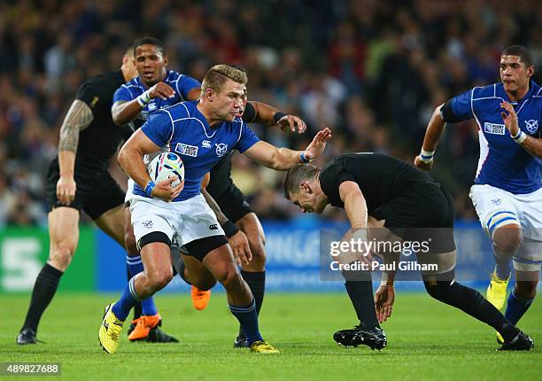 Johan Deysel of Namibia is tackled by Colin Slade of the New Zealand All Blacks during the 2015 Rugby World Cup Pool C match between New Zealand and...