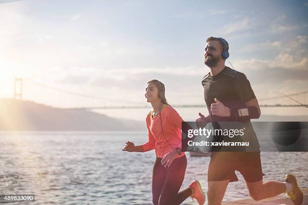 running at sunrise - runner sunrise stock pictures, royalty-free photos & images