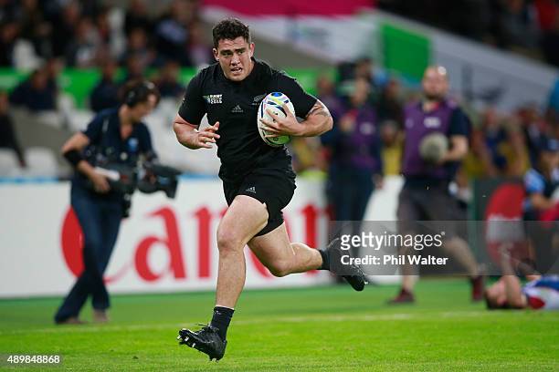 Codie Taylor of the All Blacks scores a try during the 2015 Rugby World Cup Pool C match between New Zealand and Namibia at Olympic Stadium on...
