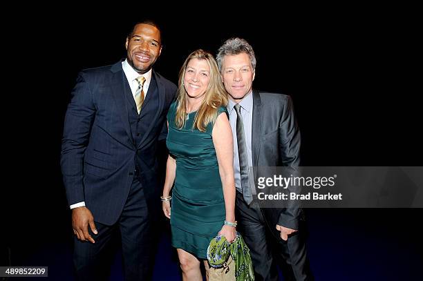 Michael Strahan, Dorothea Hurley and Jon Bon Jovi attend The Robin Hood Foundation's 2014 Benefit at Jacob Javitz Center on May 12, 2014 in New York...