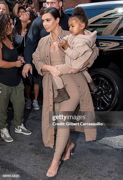 Kim Kardashian West and her daughter North West are seen arriving at Kanye West Yeezy Season 2 during Spring 2016 New York Fashion Week at Skylight...