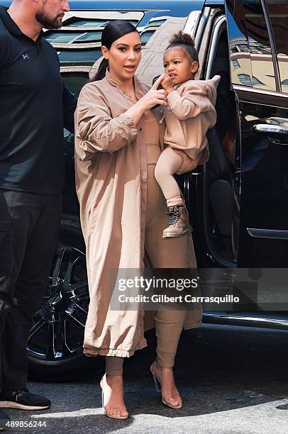 Kim Kardashian West and her daughter North West are seen arriving at Kanye West Yeezy Season 2 during Spring 2016 New York Fashion Week at Skylight...