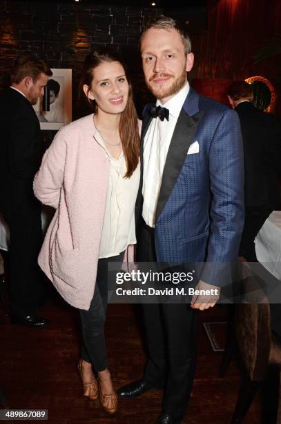 Holly Grace and Mr Hudson attend a private celebratory dinner for Alistair Guy's exhibition 'White Shirts' at The Century Club on May 12, 2014 in...