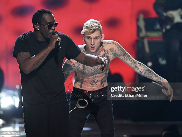 Recording artist Sean "Puff Daddy" Combs and rapper Machine Gun Kelly perform at the 2015 iHeartRadio Music Festival at MGM Grand Garden Arena on...