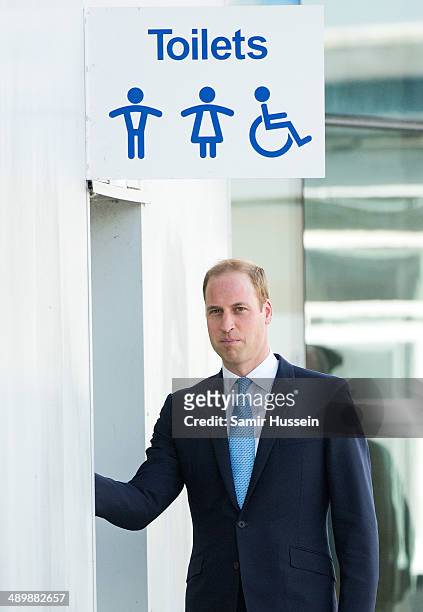 Prince William, Duke of Cambridge walks into a public toilet during an official visit to The Royal Navy Submarine Museum on May 12, 2014 in Gosport,...