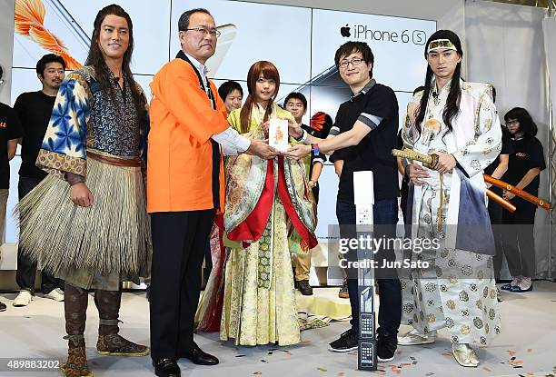 Actor Kenta Kiritani, CEO of KDDI Takashi Tanaka, actress Kasumi Arimura, guest and actor Shota Matsuda attend the news conference of launching...